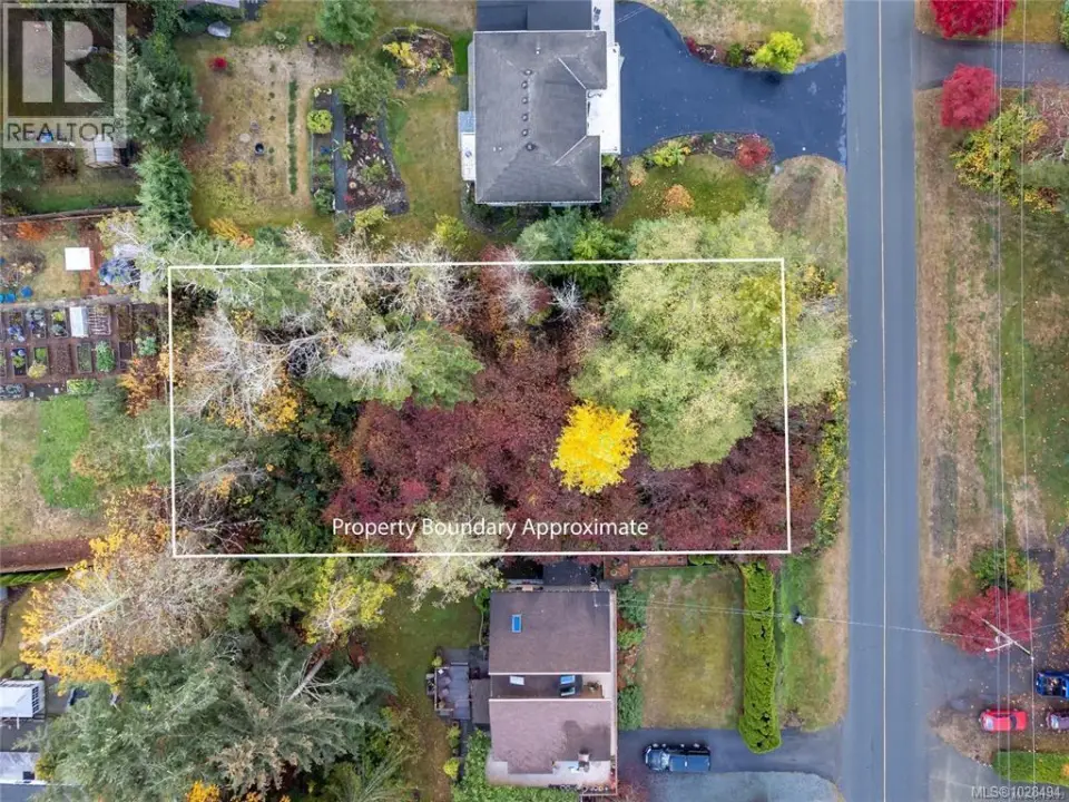 Aerial view of property and surrounding area with property parcel outlined