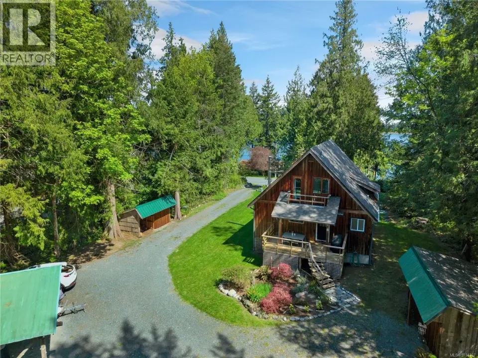 Extensively renovated home on 0.46 acre oceanview property, located a short walk from the entry to Rebecca Spit Provincial Park!