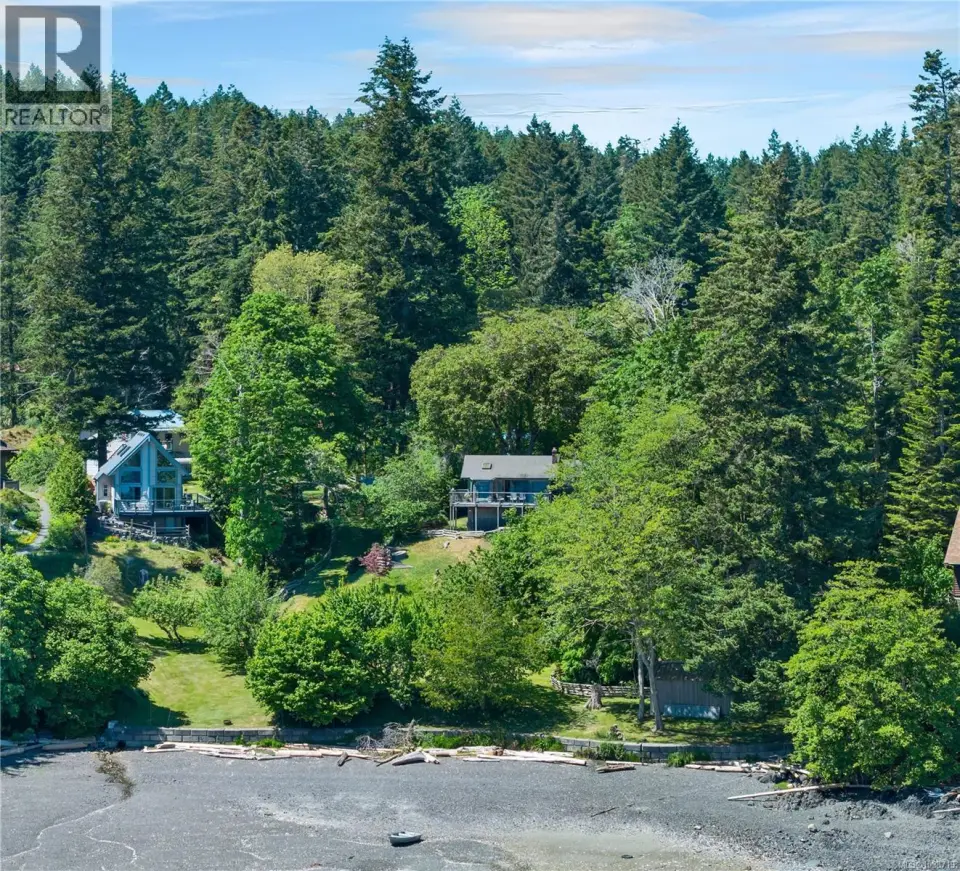 Two homes, shop with carriage suite on incredible 1.7 acre oceanfront property, overlooking Heriot Island and Heriot Bay!