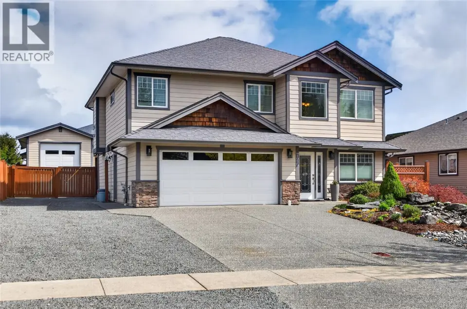 front of house with side access to detached shop / RV parking