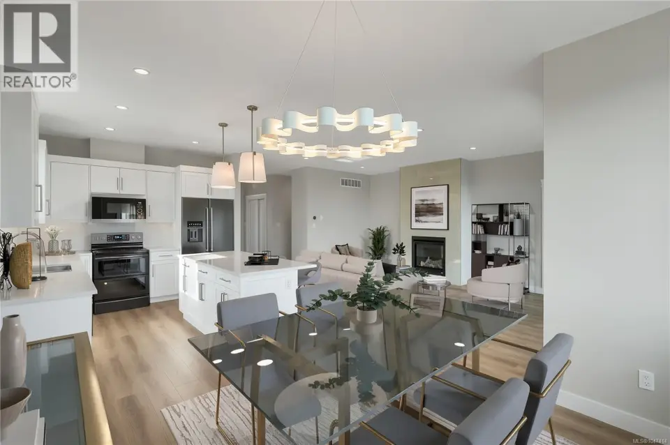 Main level living, dining and kitchen. Virtually Staged.